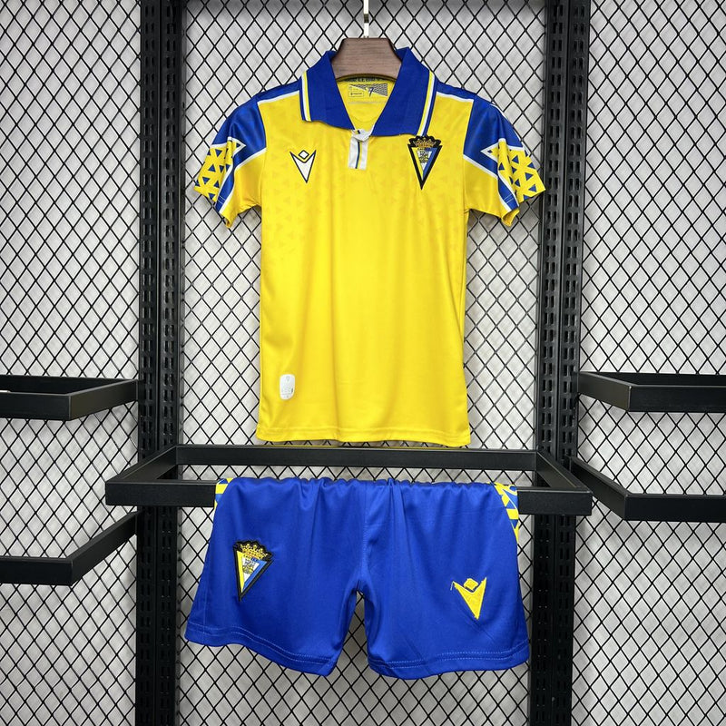 Kit Infantil Cádiz Home 24/25 Unissex Macron - Amarelo e Azul